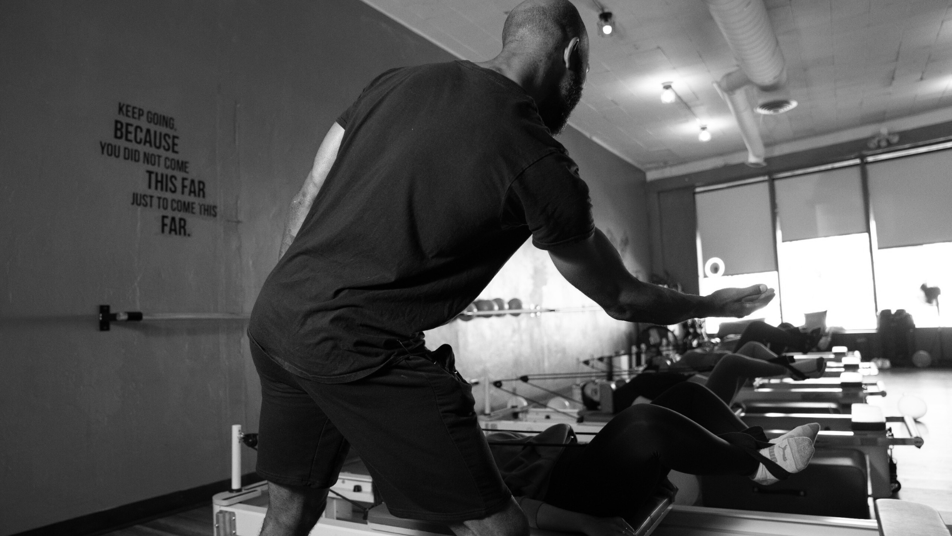 Back pain relief starts with a Reformer Pilates warm up.